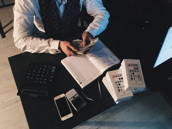 Calculator and pen on financial paperwork