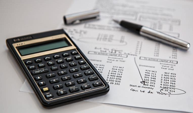 Calculator resting on a printed financial statement